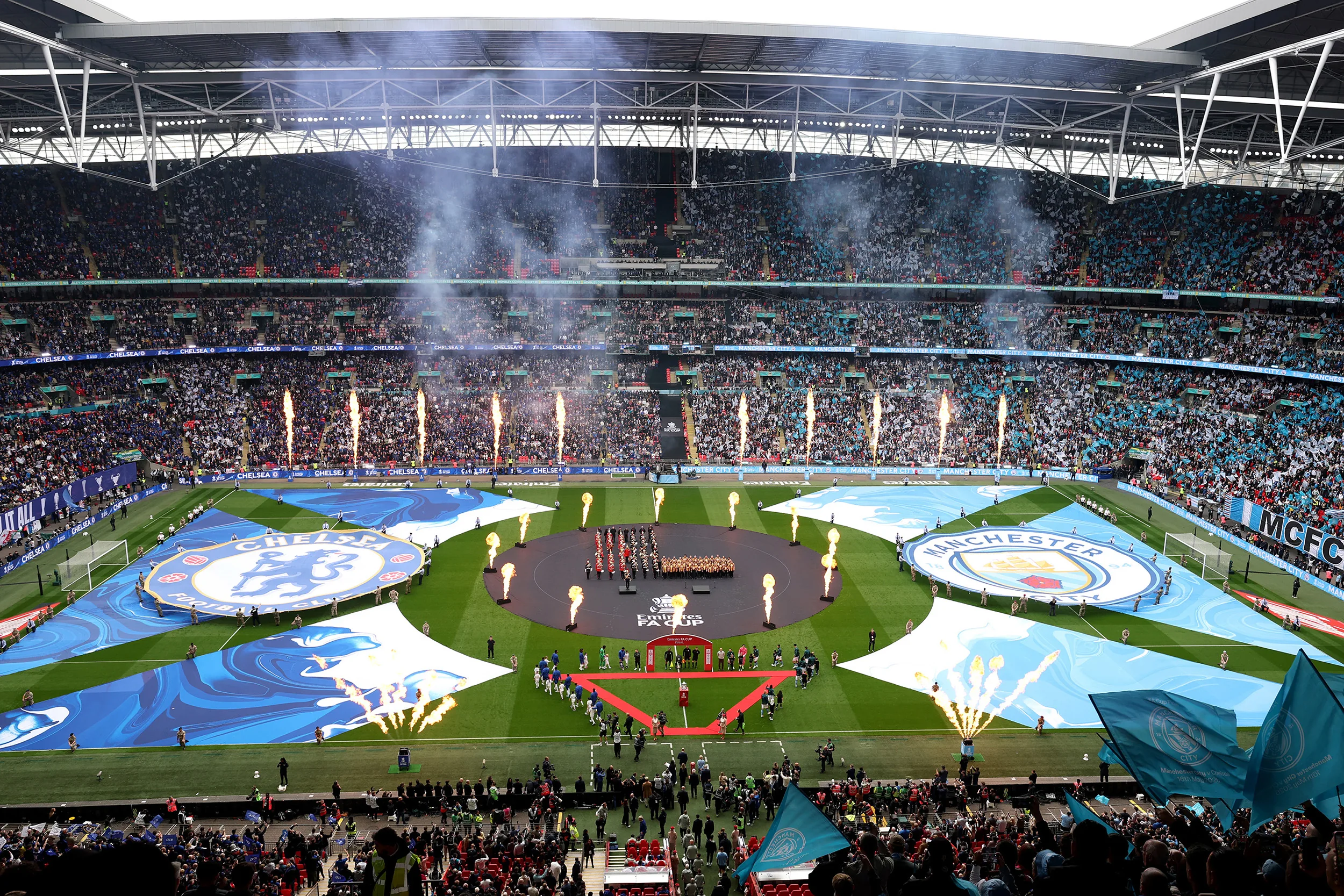 Craig Black's large-scale pitch artwork framing the pre-match ceremony inside a packed Wembley Stadium ahead of the Emirates FA Cup Final between Chelsea and Manchester City.